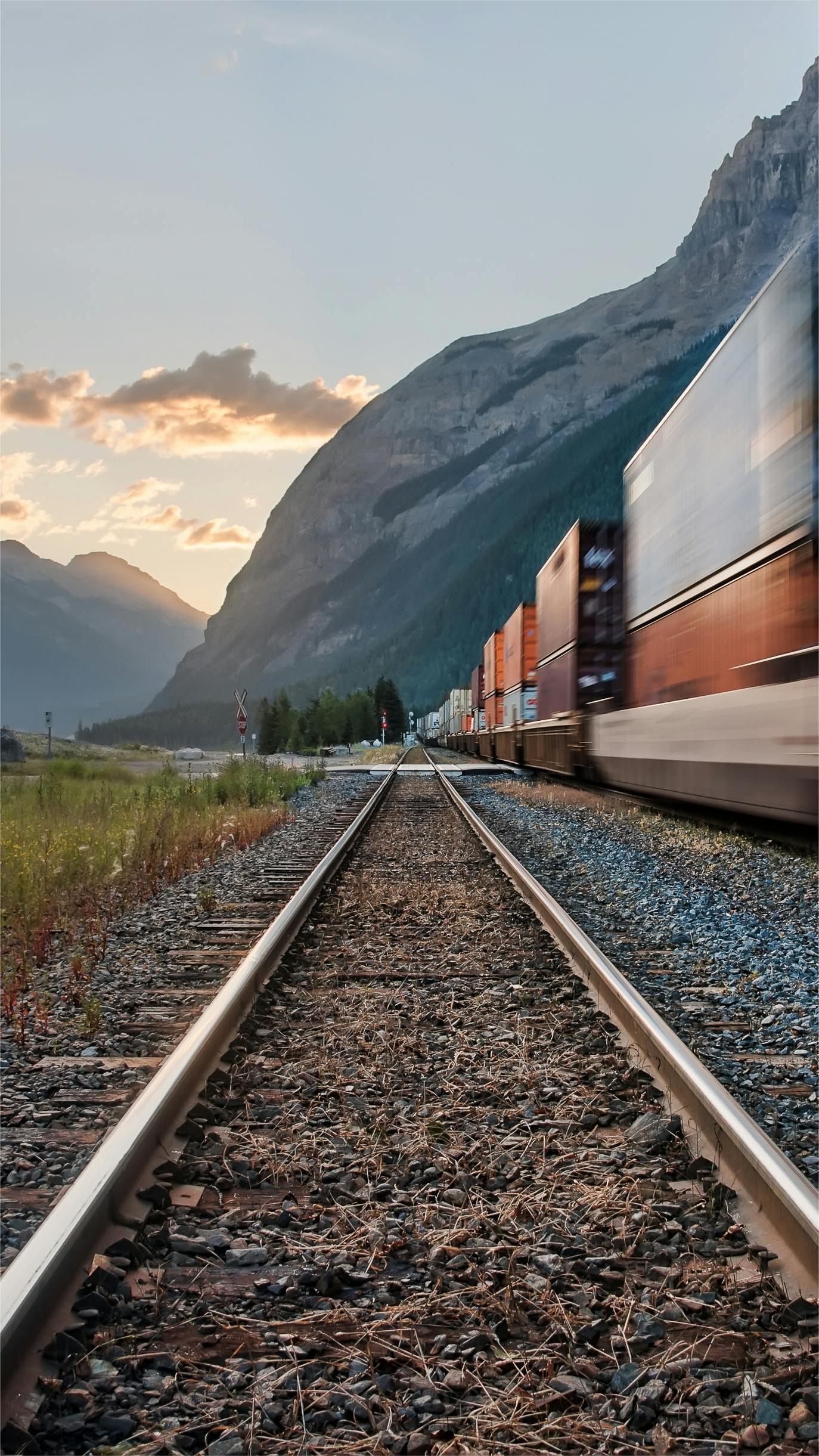Shipping containers stacked at a busy port in China, ready for FCL shipment